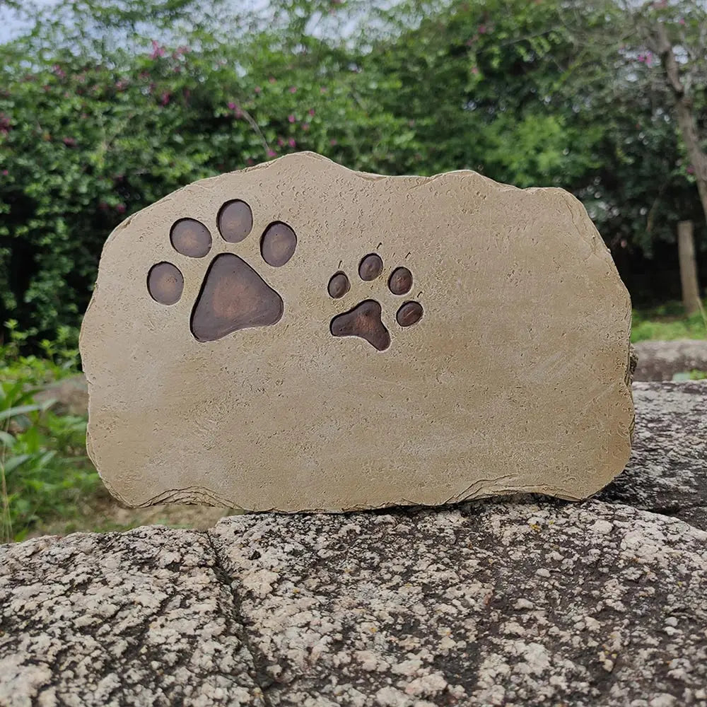 Engraved paw print detail on PawVault pet memorial garden stone – PawVault